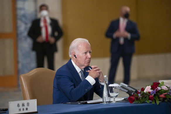 Joe Biden listens during a meeting with Chinese President Xi Jinping on the sidelines of the G20 summit.