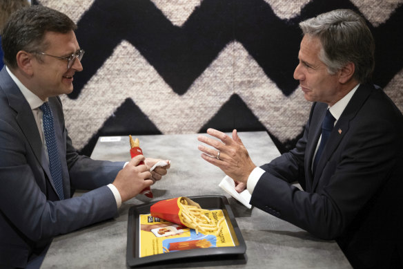 Ukraine Foreign Minister Dmytro Kuleba and US Secretary of State Antony Blinken talk as they eat at a McDonald’s in Kyiv.