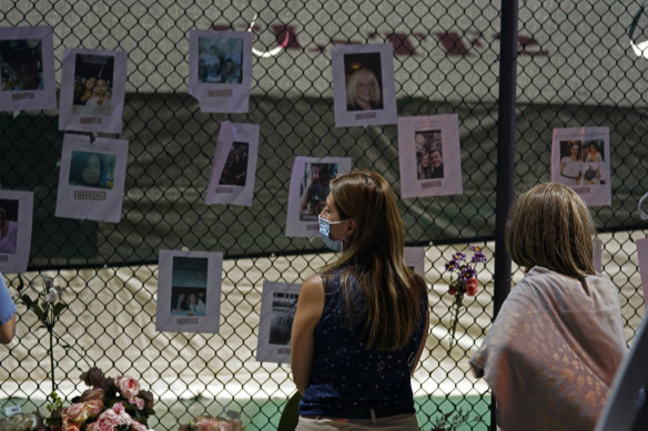 A makeshift memorial displays photos of some of the missing people. 