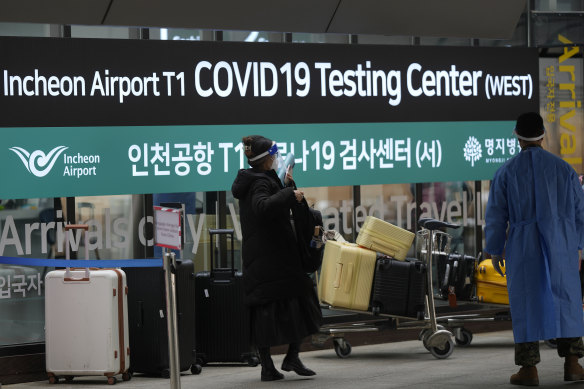 Signs for a COVID-19 testing centre at the Incheon International Airport.