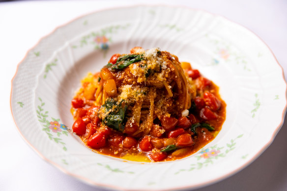 Tajarin pasta, made with extra egg yolk, are twisted through a fresh-tasting pomodoro sauce.