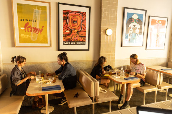 The walls at Eat Pierogi Make Love are decorated with colourful pop-art Polish posters.