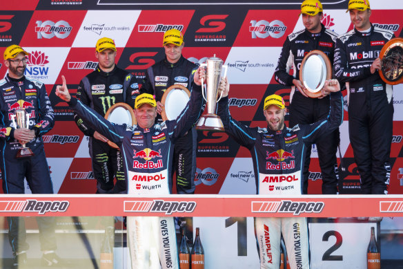 Shane van Gisgergen and Garth Tander celebrate their Bathurst victory.