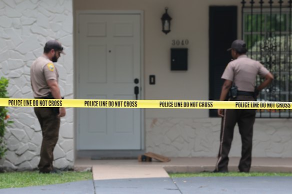 Authorities stationed outside the home of Perez Hilton.