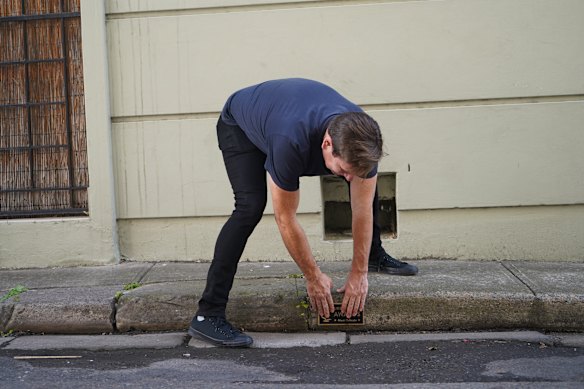 Michael Pederson at work installing one of his mysterious interventions.