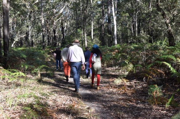 Dozens of residents gathered at the bushland site on Sunday. They're concerned the development will swallow up unburnt bushland. 