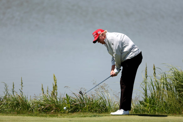 Former US president Donald Trump playing at Trump National golf course.
