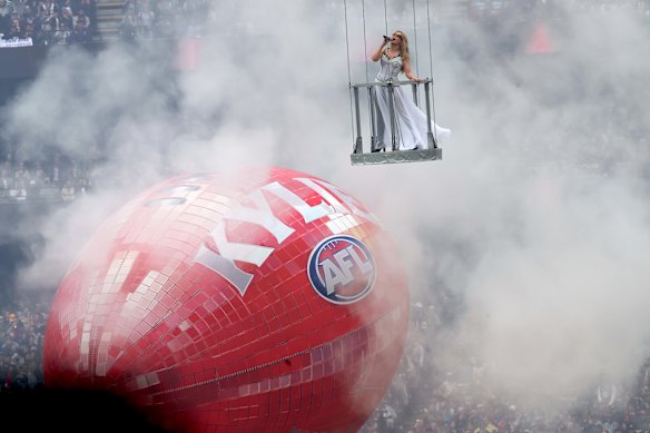 Kylie Minogue performs before the match begins.