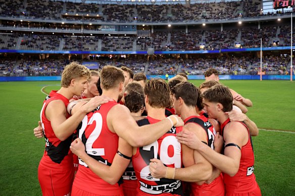 Bombers during their pre-game huddle. 