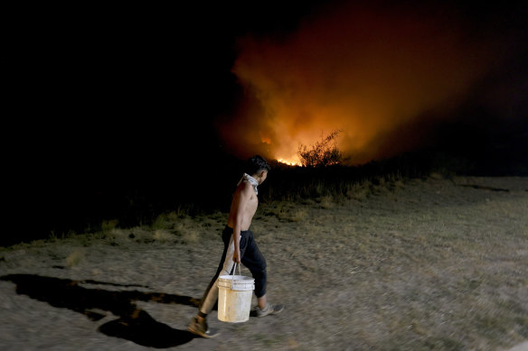 A resident helps to fight the fires in Cordoba province, Argentina.