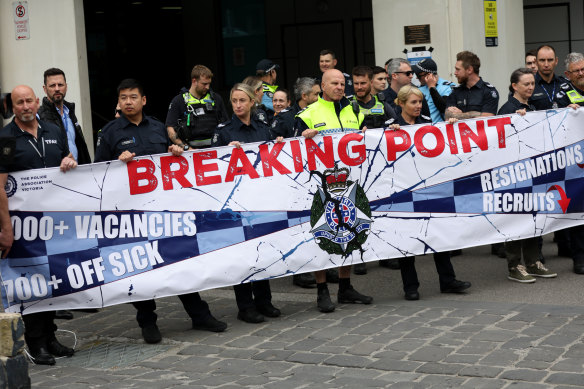 Police officers stage a walkout in November 2024, during the police union’s pay deal campaign.