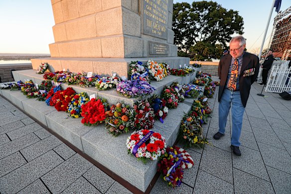A man pays his respects at the Kings Park Service.