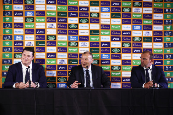 Andy Marinos (right) listens to Eddie Jones talking at a press conference.