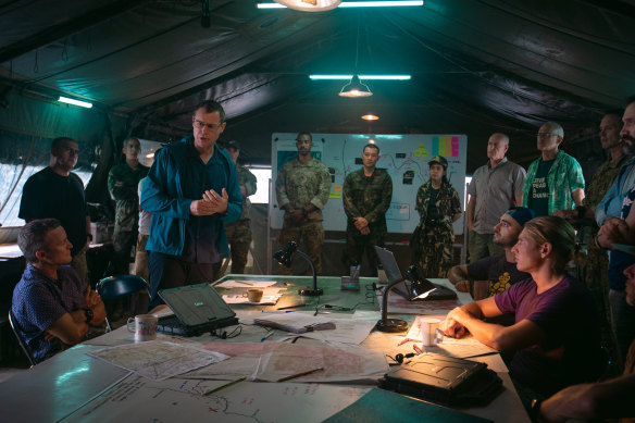 Rodger Corser (standing, left) plays Australian cave dive hero Dr Richard “Harry” Haris in Thai Cave Rescue. 