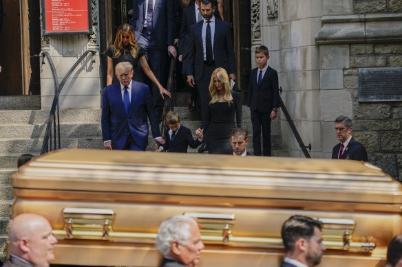 Former US president Donald Trump, far left, leads his family behind the gold-hued casket of his ex-wife Ivana at St Vincent Ferrer Roman Catholic Church in New York.