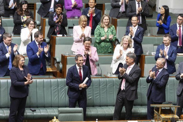 Treasurer Jim Chalmers is congratulated by colleagues after delivering the budget speech on Tuesday.