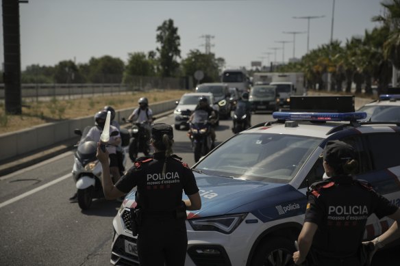 Catalan police at a checkpoint on the outskirts of Barcelona on Thursday.