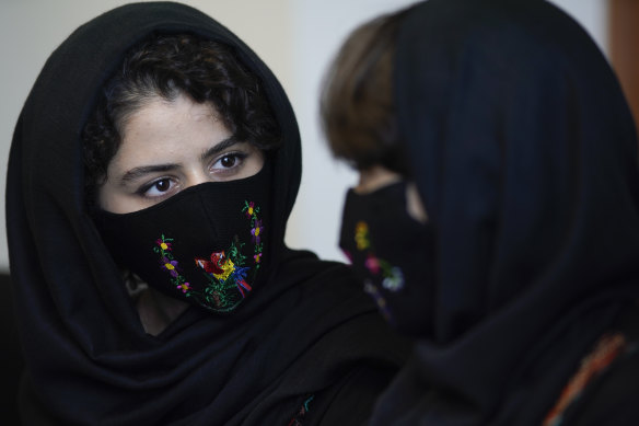 Kawsar, left, a member of the Afghan all-girls robotics team, speaks during an interview in Mexico City.