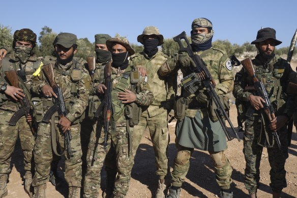 Syrian opposition fighters after entering the village of Anjara, on the western outskirts of Aleppo, on Thursday.