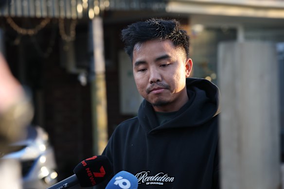 Neighbour Thang Zanniat speaks to the media after Victoria Police confirmed a person has died in an early morning house fire at Newbury St, Werribee. 
