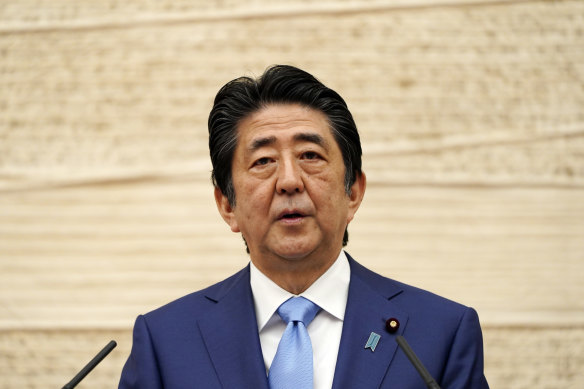 Shinzo Abe speaks to the press in 2020.