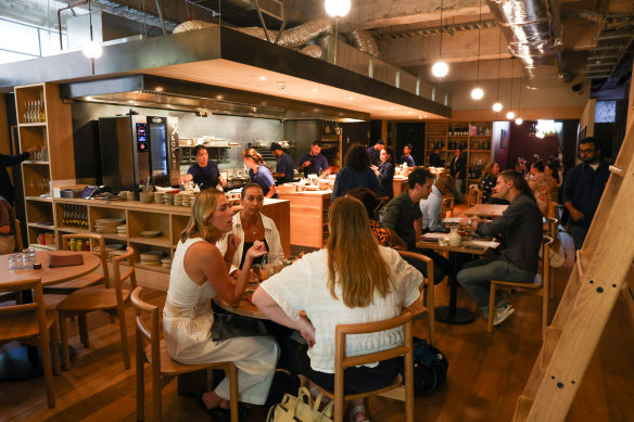 There’s no physical barrier between the bar and restaurant, but a shift from terrazzo to floorboards delineates them.