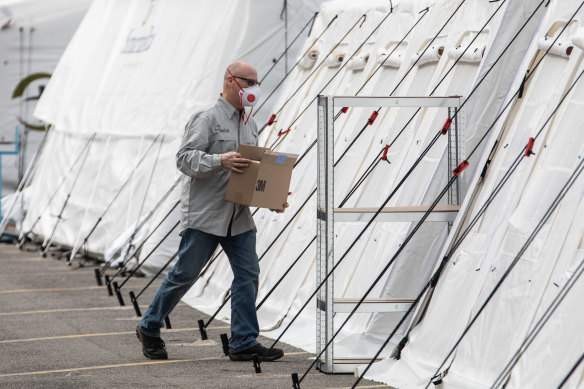 A man handles a box at a Samaritan's Purse Emergency Field Hospital in Cremona, near Milan, Italy.