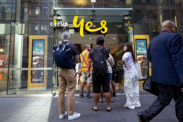 Customers line up outside an Optus shop front on George Street in Sydney during a country-wide network outage.
