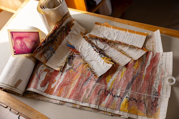 One of the transparencies provided by Arthur Boyd, pictured with thread swatches and a section of weaving drawing. 