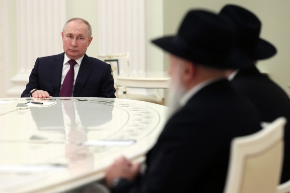 Russian President Vladimir Putin speaks to chief rabbi of Russia Berl Lazar and president of the Federation of Jewish Communities Alexander Boroda at the Kremlin in  January.