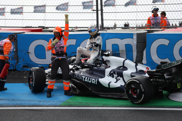 Ricciardo immediately nurses his injury as he walks from his Scuderia AlphaTauricar after the crash on Dutch track.