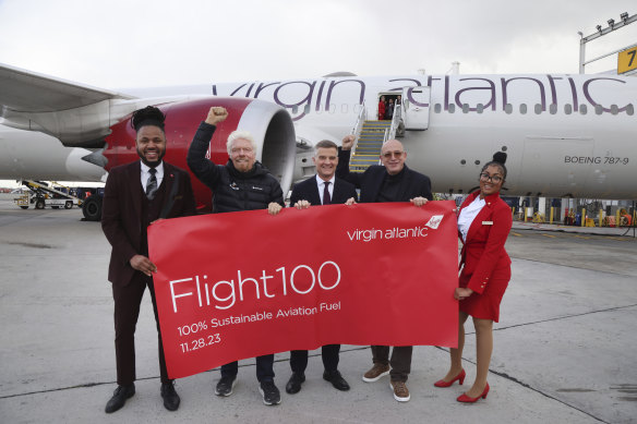 Virgin Atlantic founder Richard Branson (second from left) at the arrival of fossil-fuel-free Flight100.