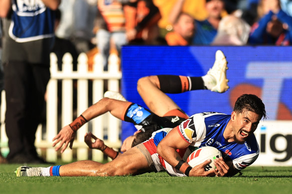 Enari Tuala dives over just before the halftime hooter.