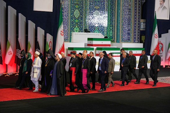 Khamenei’s casket is flanked by those of other family members killed in the war.