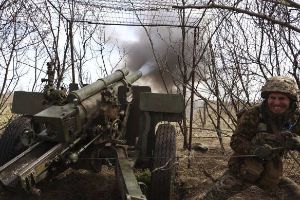 A Ukrainian soldier fires the howitzer at the Russian positions on the frontline near Kremenna, Luhansk region last month.