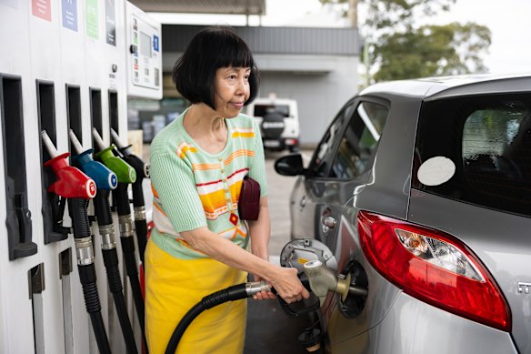 Amy Mok fills her car at a Strathfield service station on Monday. 
