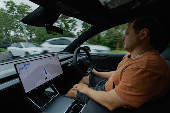 Alex Pisarev in his Tesla operating in Full Self-Driving mode