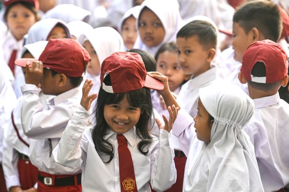 Students attend orientation on the first day of the school year at Ciater elementary school in South Tangerang, Banten Province, Indonesia, on July 15.