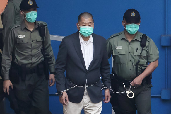 Jimmy Lai, centre, pictured in custody earlier this month.
