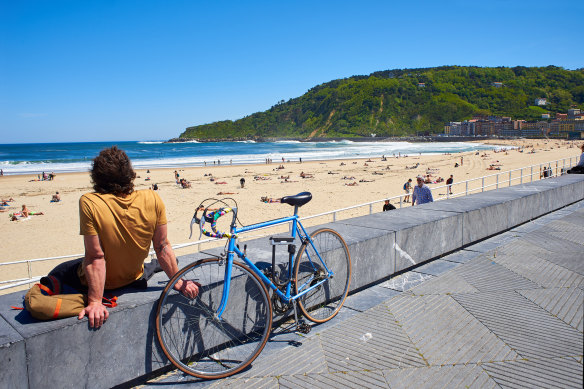 Zurriola beach and Monte Ulia in background in San Sebastian, Guipuzcoa, Spain. Cigarette butts left on the beach end up in the stomach of sea creatures.