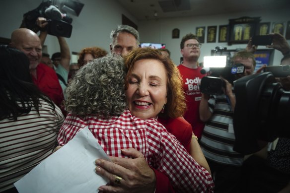 Jodie Belyea celebrates her byelection victory with a hug.