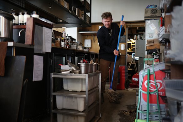 Shaun McKinlay cleaning up the Wye River General Store. 