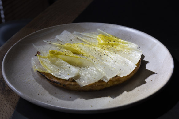 Chickpea pancake with witlof, hazelnut and preserved mandarin.