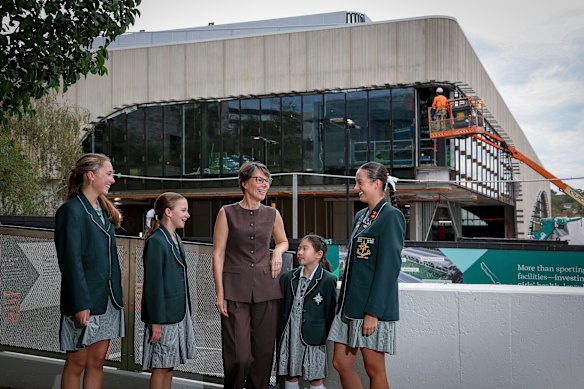 MLC principal Julia Shea is joined by students near the school’s aquatic centre, which is due to open in June.