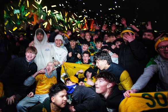 Fans wait for the Socceroos’ knockout match against Egypt to start at Fed Square.