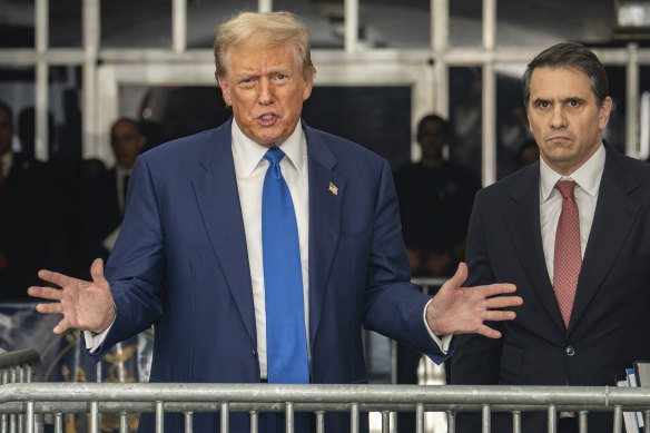 Trump speaks to the media at Manhattan criminal court on Friday (US time).