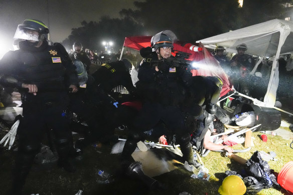 Police advance on pro-Palestinian demonstrators in an encampment on the UCLA campus in Los Angeles.