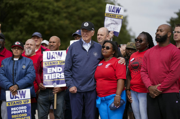 Joe Biden stands with striking autoworkers.