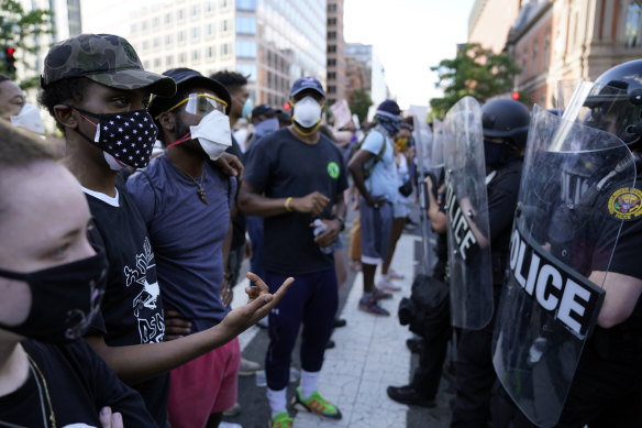 Demonstrators protest the death of George Floyd near the White House in Washington. 