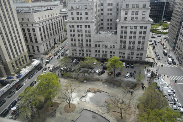 White fire extinguisher residue marks the spot in Collect Pond Park where a man lit himself on fire outside Manhattan criminal court on Friday.